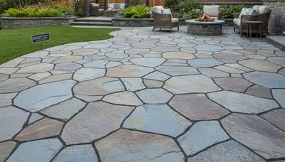 Professional flagstone patio installation with natural stone pavers in Tacoma, WA landscaping project