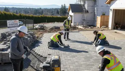 Professional crew installing driveway pavers in Tacoma, WA with expert landscaping craftsmanship